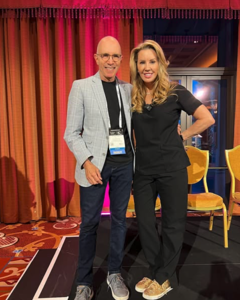Dr. Mark Tager with a colleague at a professional event